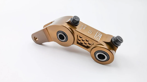 Warp 9 Rear Suspension Linkage Riser for Surron - Gold 0.75"